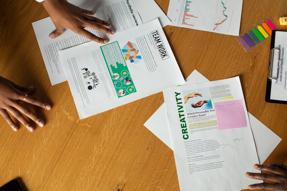 Team members engage in a collaborative document review session, showcasing teamwork and creativity.